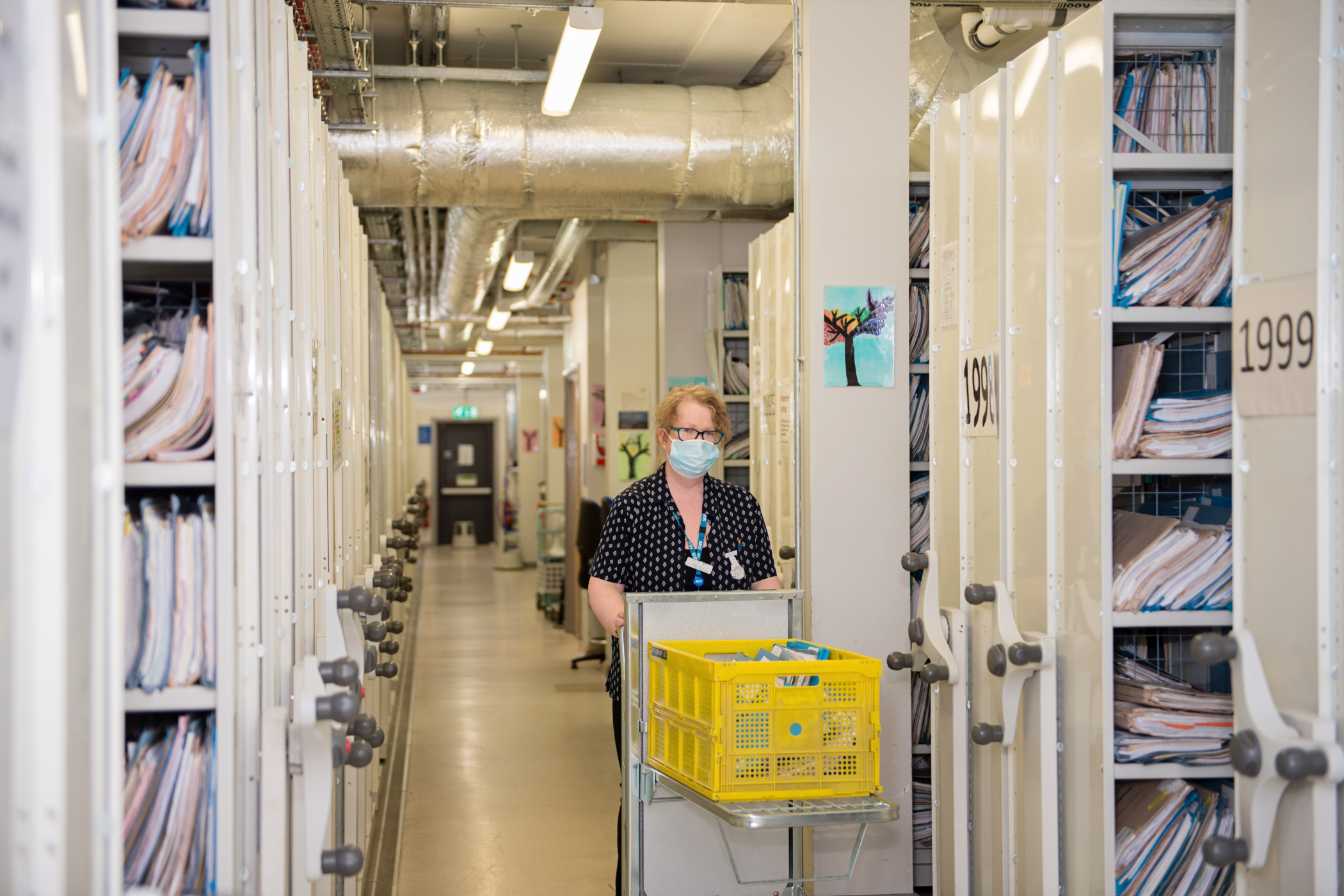 60. Medical records - staff with trolley.jpg